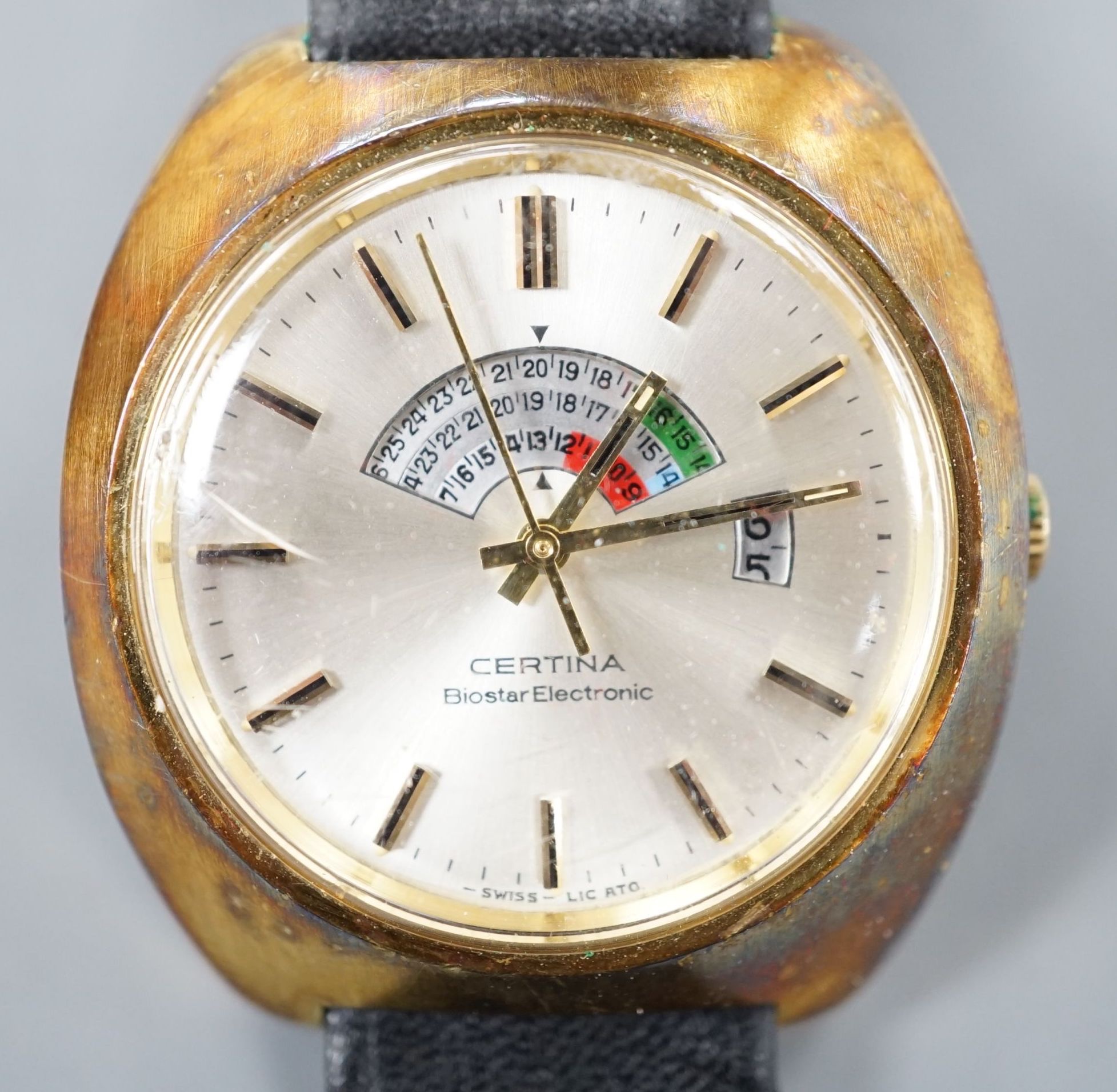 A gentleman's 1970's gilt and steel Certina Biostar Electronic wrist watch, on associated black leather strap, case diameter 39mm, with Certina box.